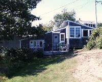 Grey Cottage - Harborside. Queen bed with bath. Living room with fireplace, porch, refrigerator, microwave